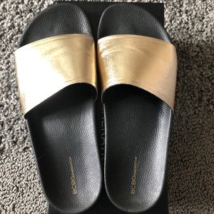 BCBGeneration Cyabee-X Black and Gold Slides